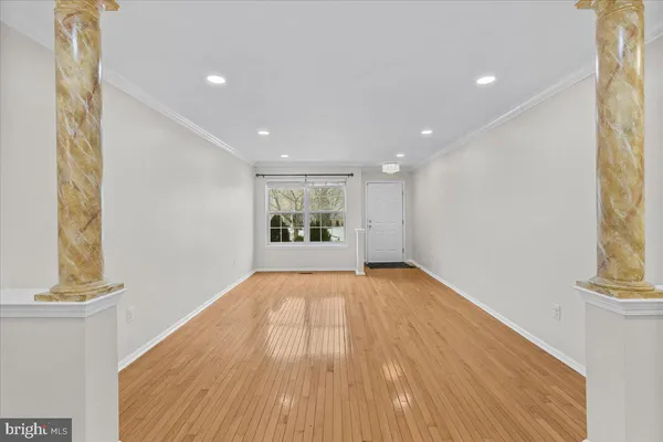 a white toilet sitting next to a white sink