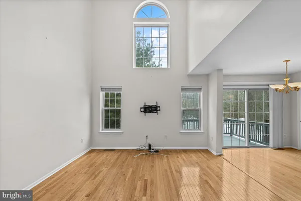 a kitchen with granite countertop a stove a sink and dishwasher wooden cabinets with granite countertops