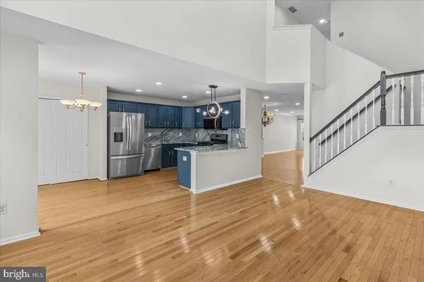 a kitchen with granite countertop a sink and cabinets