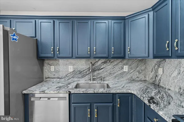 a view of a big room with wooden floor and windows