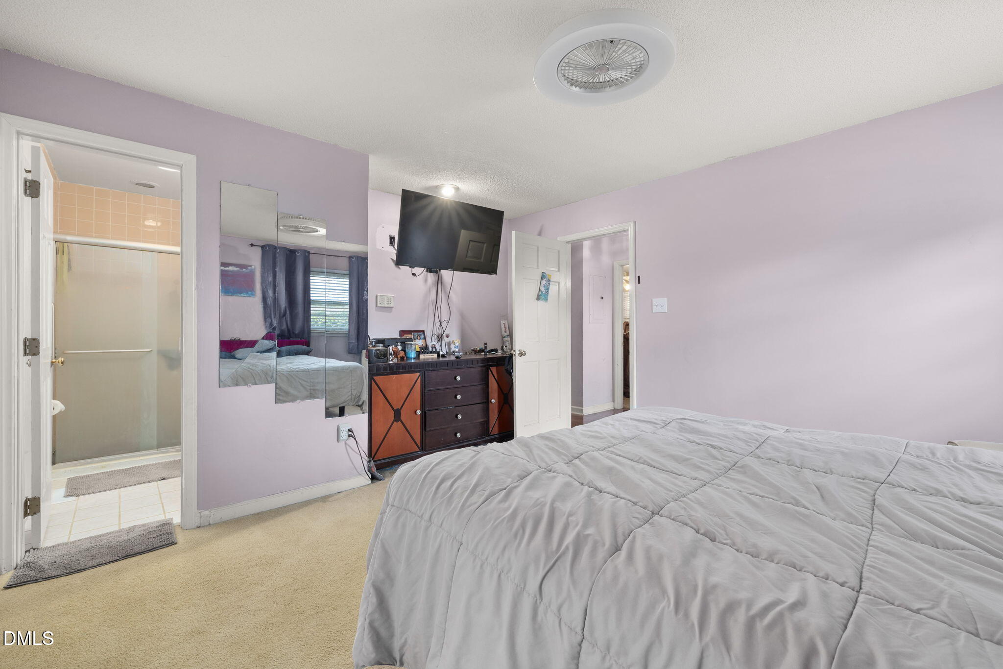 4017 Tryon Road Raleigh, NC 27606 - Photo 19 of 39 a large bedroom with a bed dresser and a large window