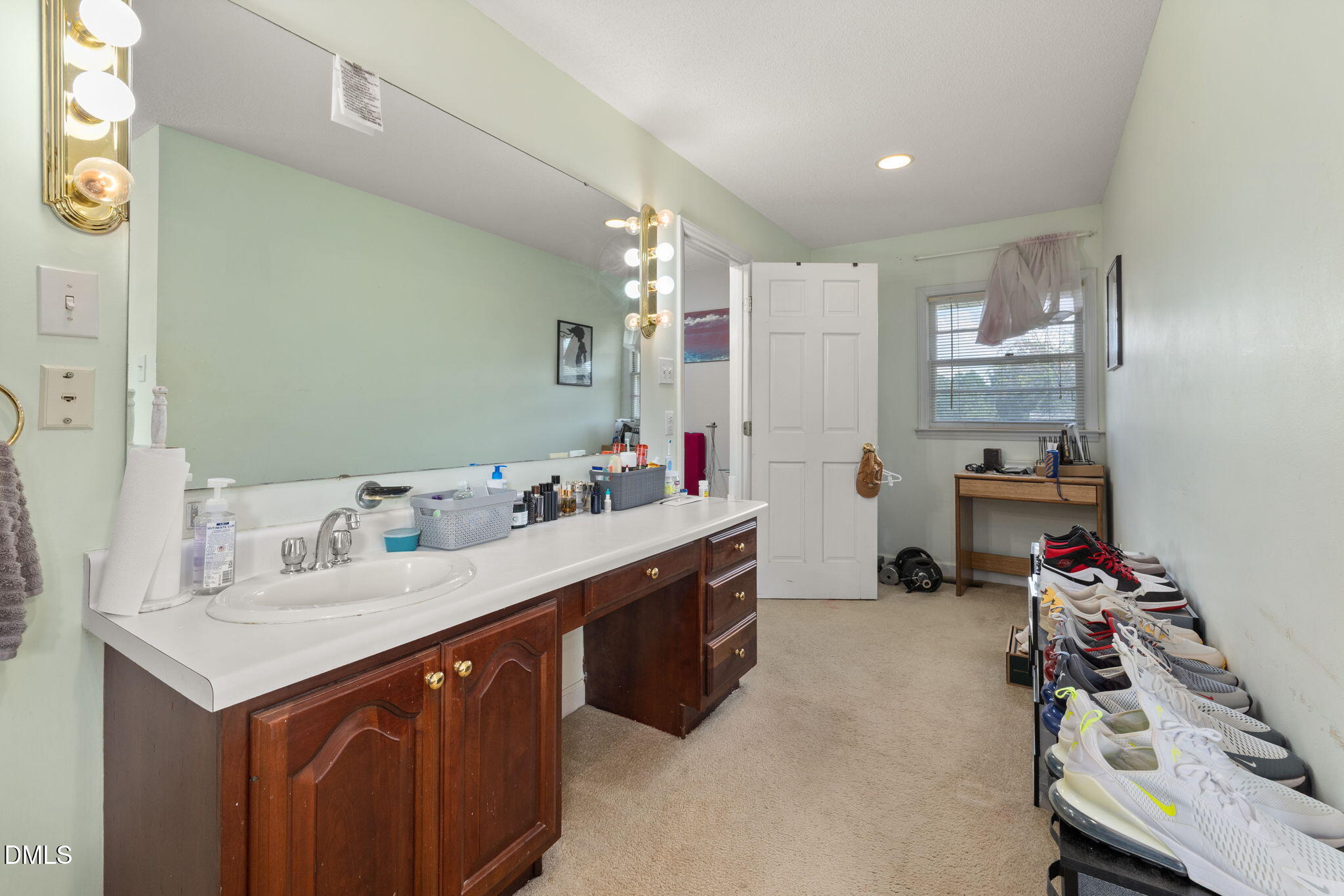 4017 Tryon Road Raleigh, NC 27606 - Photo 20 of 39 a kitchen with granite countertop a sink stove and cabinets