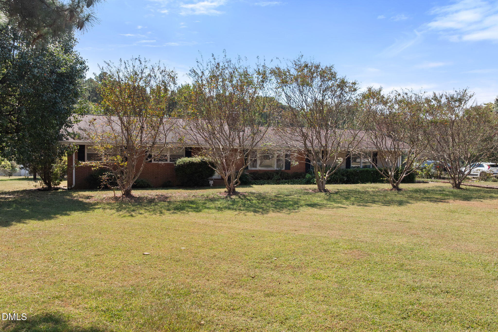 4017 Tryon Road Raleigh, NC 27606 - Photo 4 of 39 a view of a yard with swimming pool and trees in the background