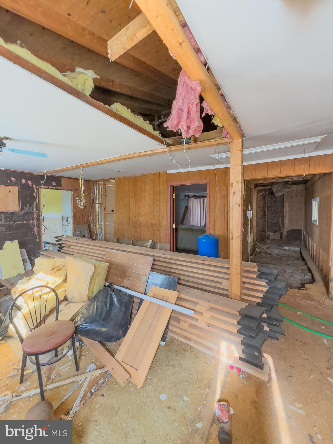 11101 Winchester Grade Road Berkeley Springs, WV 25411 - Photo 23 of 44 a living room with furniture and a fireplace