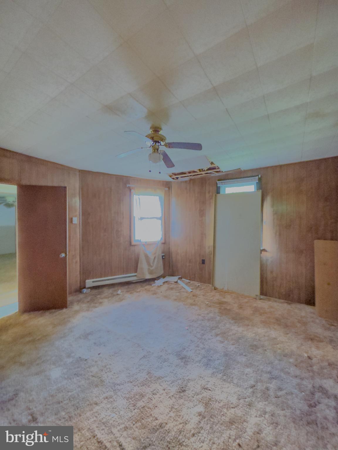 11101 Winchester Grade Road Berkeley Springs, WV 25411 - Photo 28 of 44 a view of an empty room with a window