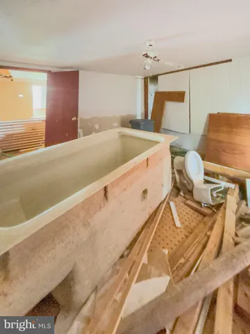 a living room with lots of furniture and a rug