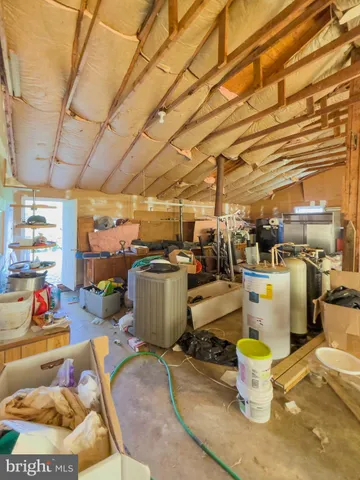 a view of a field of grass and trees