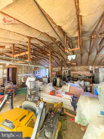 a view of a yard with a house in the background