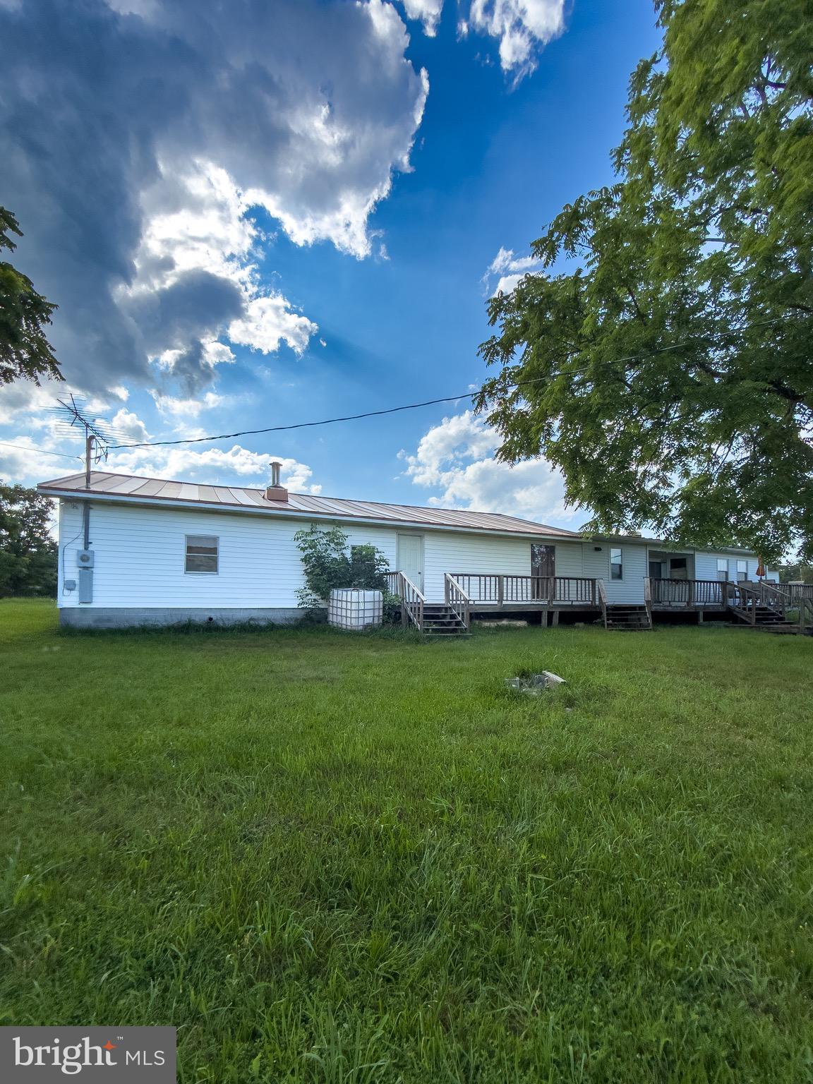 11101 Winchester Grade Road Berkeley Springs, WV 25411 - Photo 38 of 44 a view of a house with a backyard