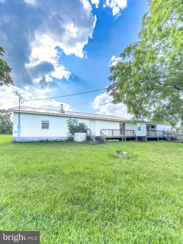 a view of outdoor space with garden and trees