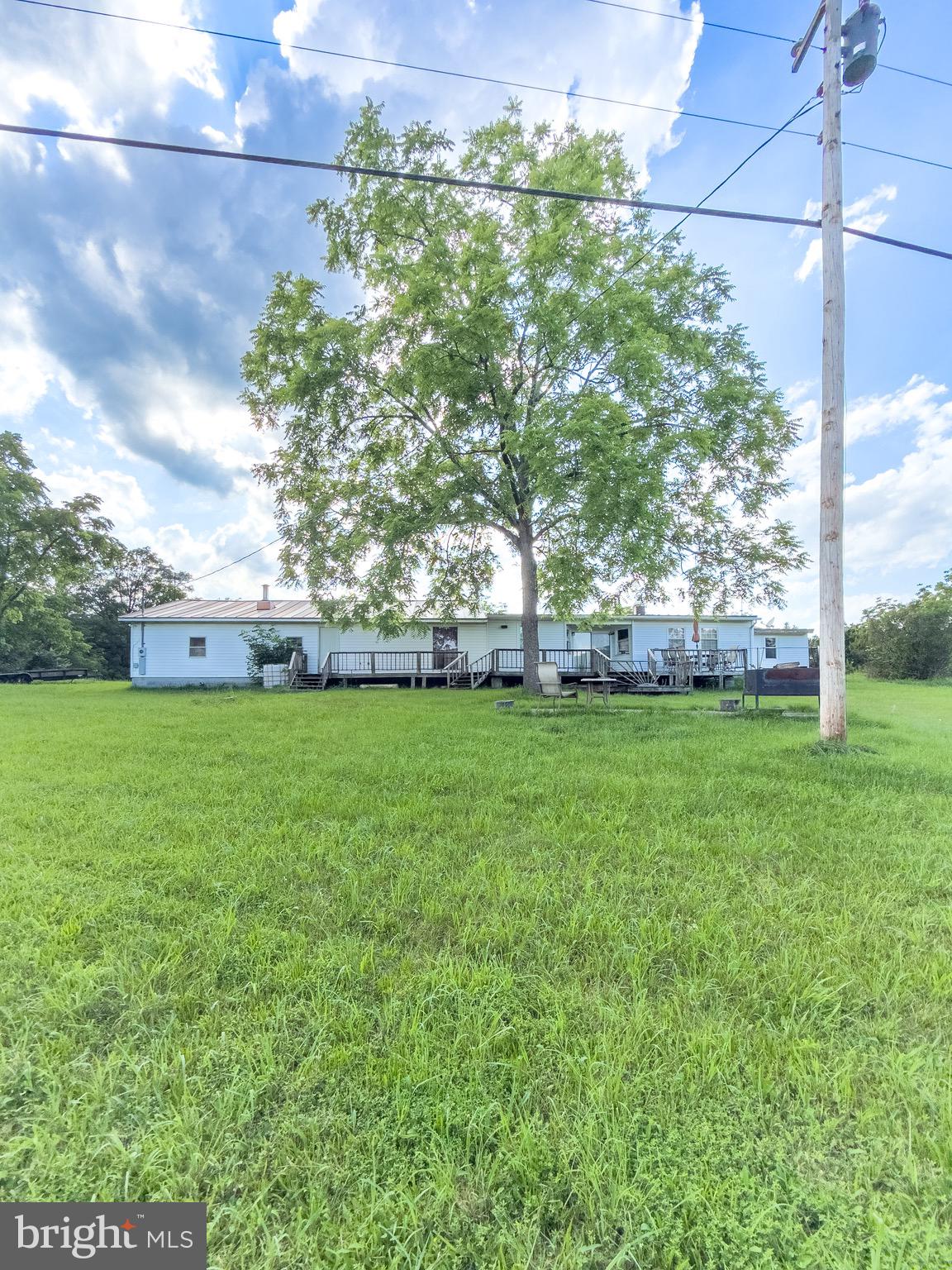 11101 Winchester Grade Road Berkeley Springs, WV 25411 - Photo 40 of 44 a view of a field of grass and trees