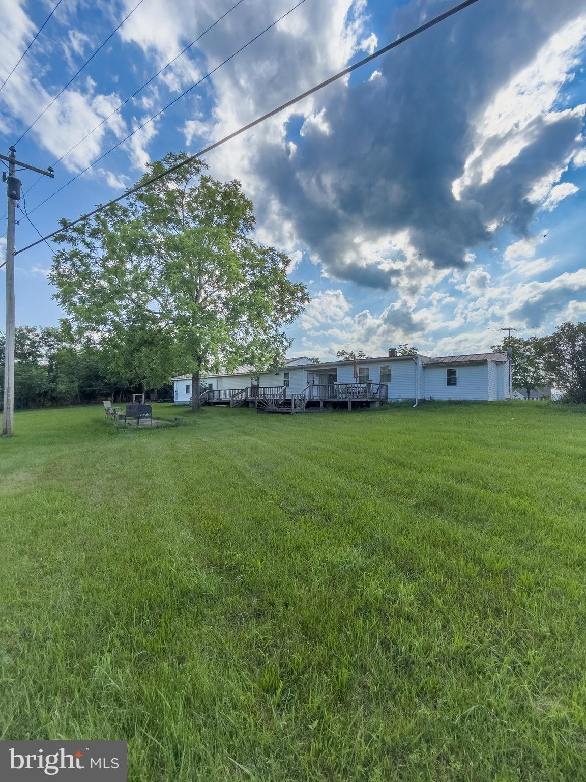 11101 Winchester Grade Road Berkeley Springs, WV 25411 - Photo 41 of 44 a view of a yard with a house in the background