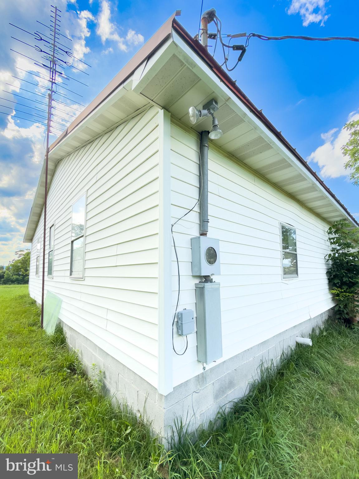 11101 Winchester Grade Road Berkeley Springs, WV 25411 - Photo 42 of 44 a front view of a house with garden