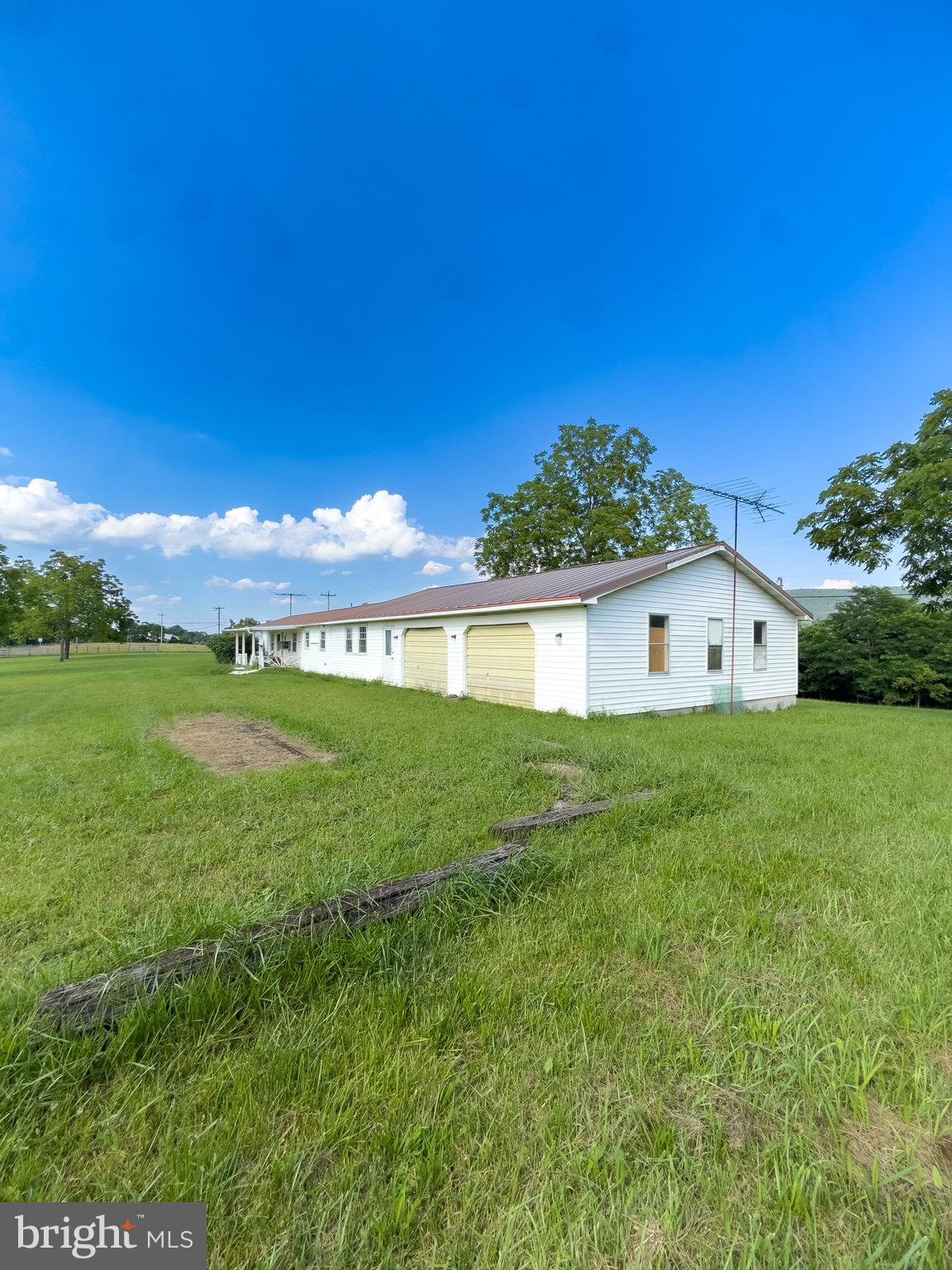 11101 Winchester Grade Road Berkeley Springs, WV 25411 - Photo 5 of 44 a view of a house with a yard