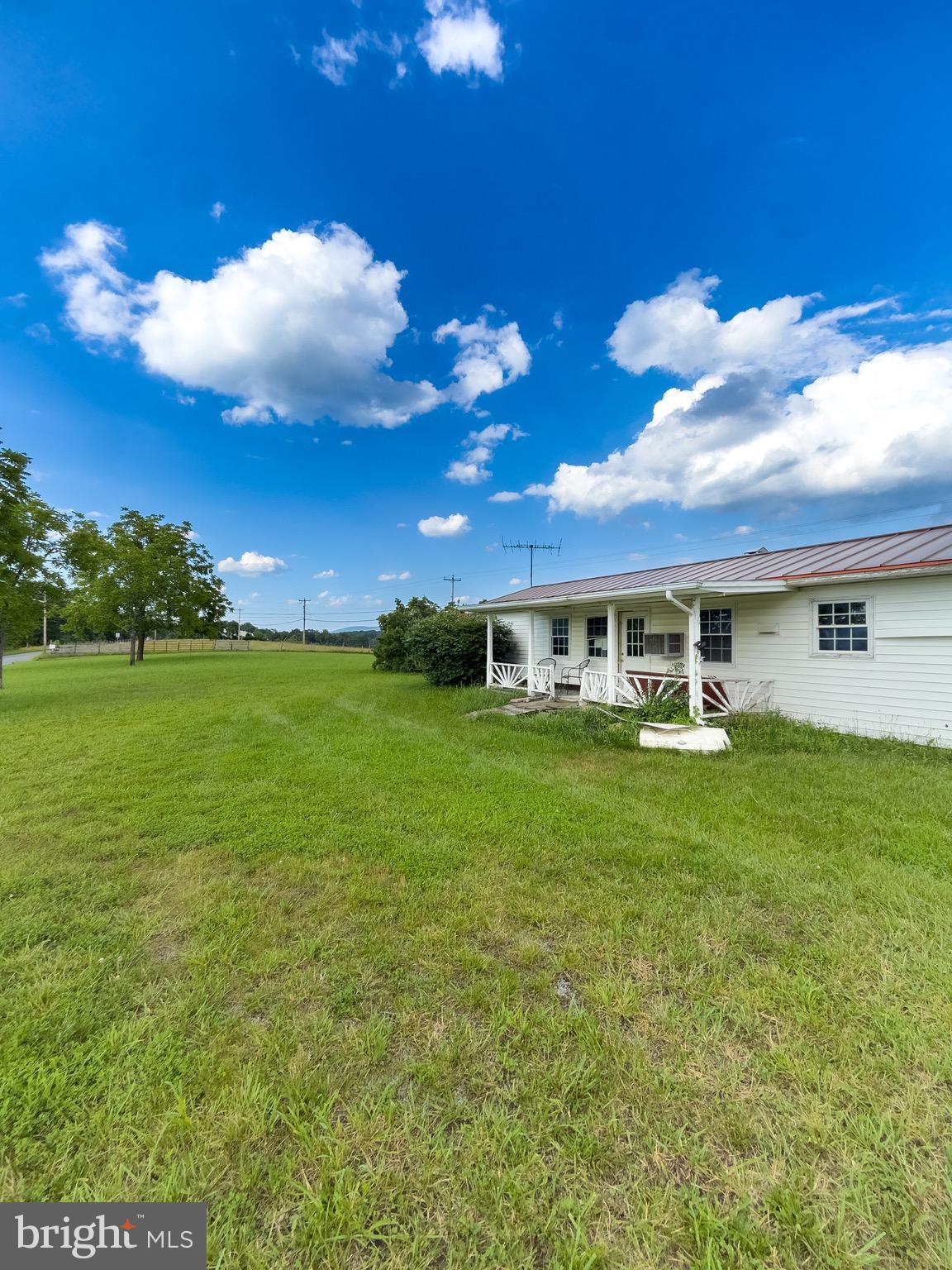11101 Winchester Grade Road Berkeley Springs, WV 25411 - Photo 10 of 44 a front view of a house with a garden