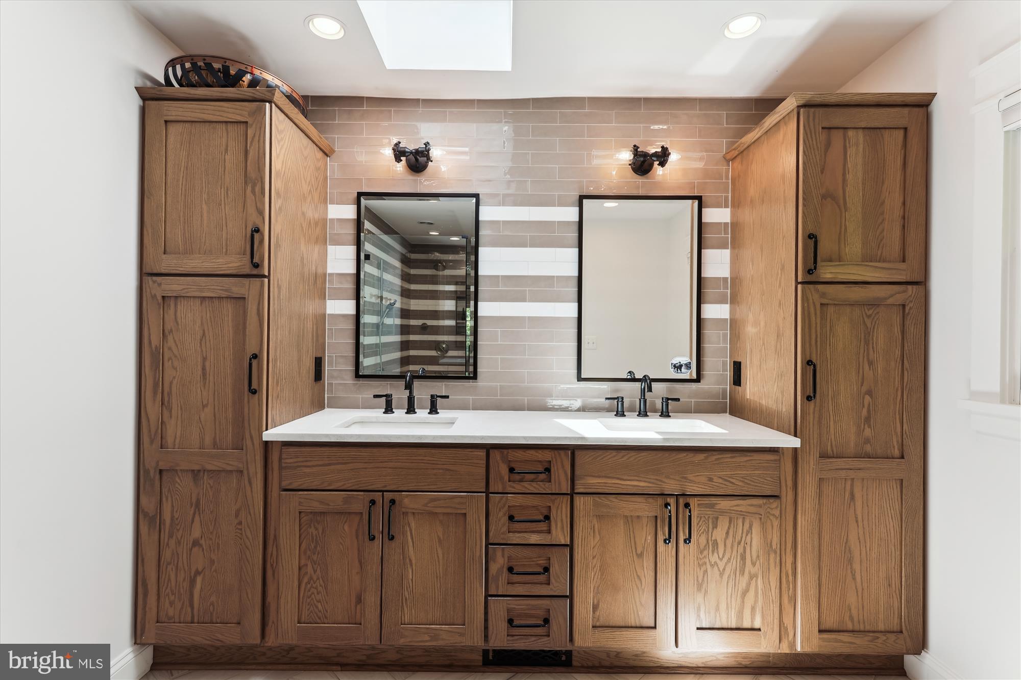 11476 Bronzedale Drive Oakton, VA 22124 - Photo 36 of 82 a bathroom with a sink and a mirror