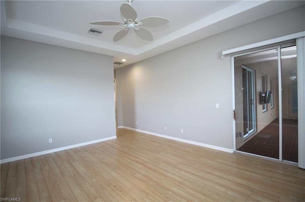 2086 Grove Drive Naples, FL 34120 - Photo 16 of 24 wooden floor in an empty room