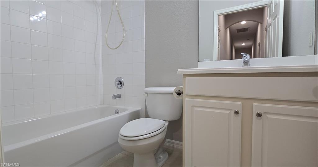 2086 Grove Drive Naples, FL 34120 - Photo 23 of 24 a bathroom with a sink a toilet and shower