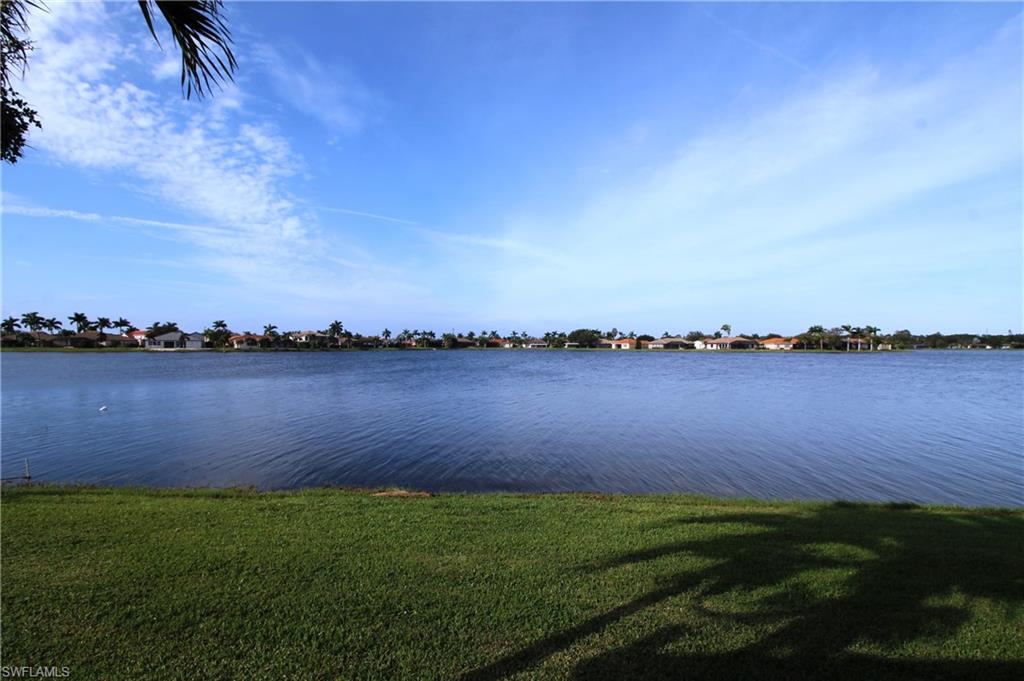 2086 Grove Drive Naples, FL 34120 - Photo 3 of 24 a view of a lake from a yard