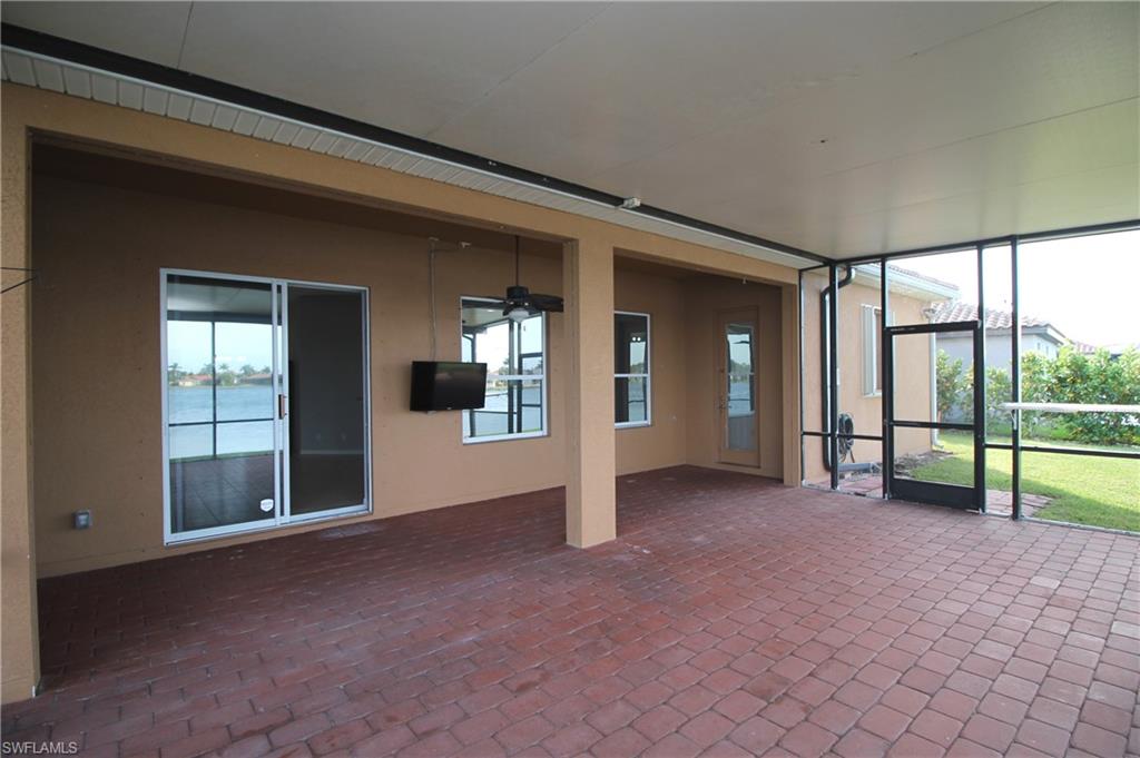 2086 Grove Drive Naples, FL 34120 - Photo 5 of 24 wooden floor and window in an empty room