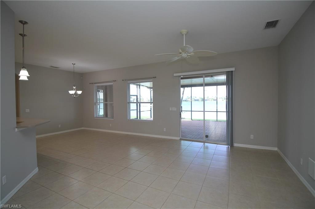 2086 Grove Drive Naples, FL 34120 - Photo 9 of 24 wooden floor in an empty room with a window