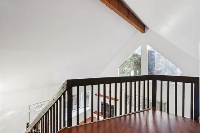a view of hallway with wooden floor