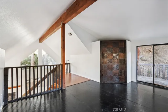 a view of a house with a wooden deck