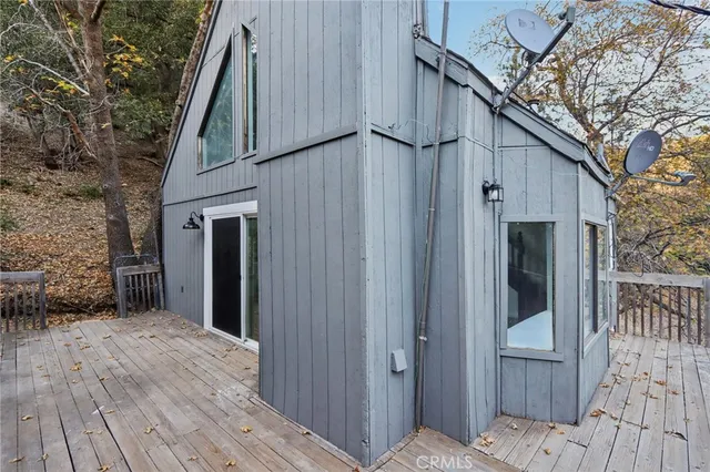 a view of deck with wooden floor and fence
