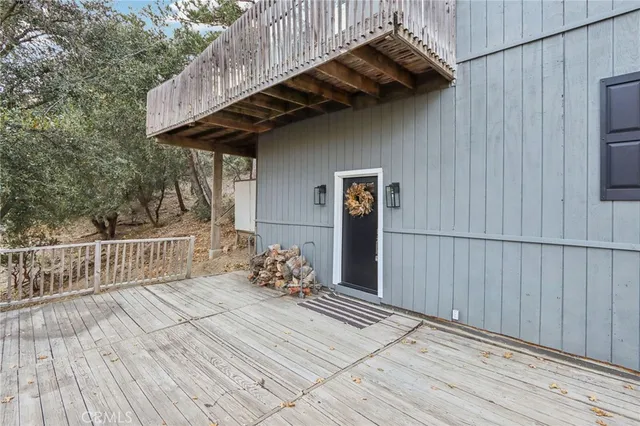 a living room with furniture fireplace and a window