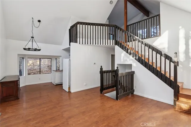 a kitchen with stainless steel appliances a refrigerator a stove a microwave and cabinets