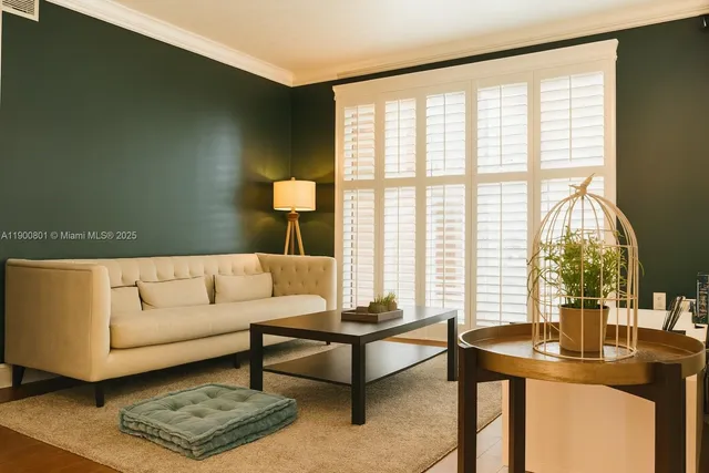 a living room with furniture and a window