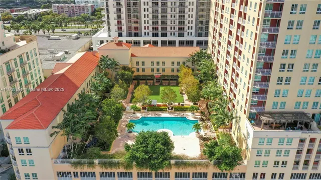 a view of a swimming pool with furniture