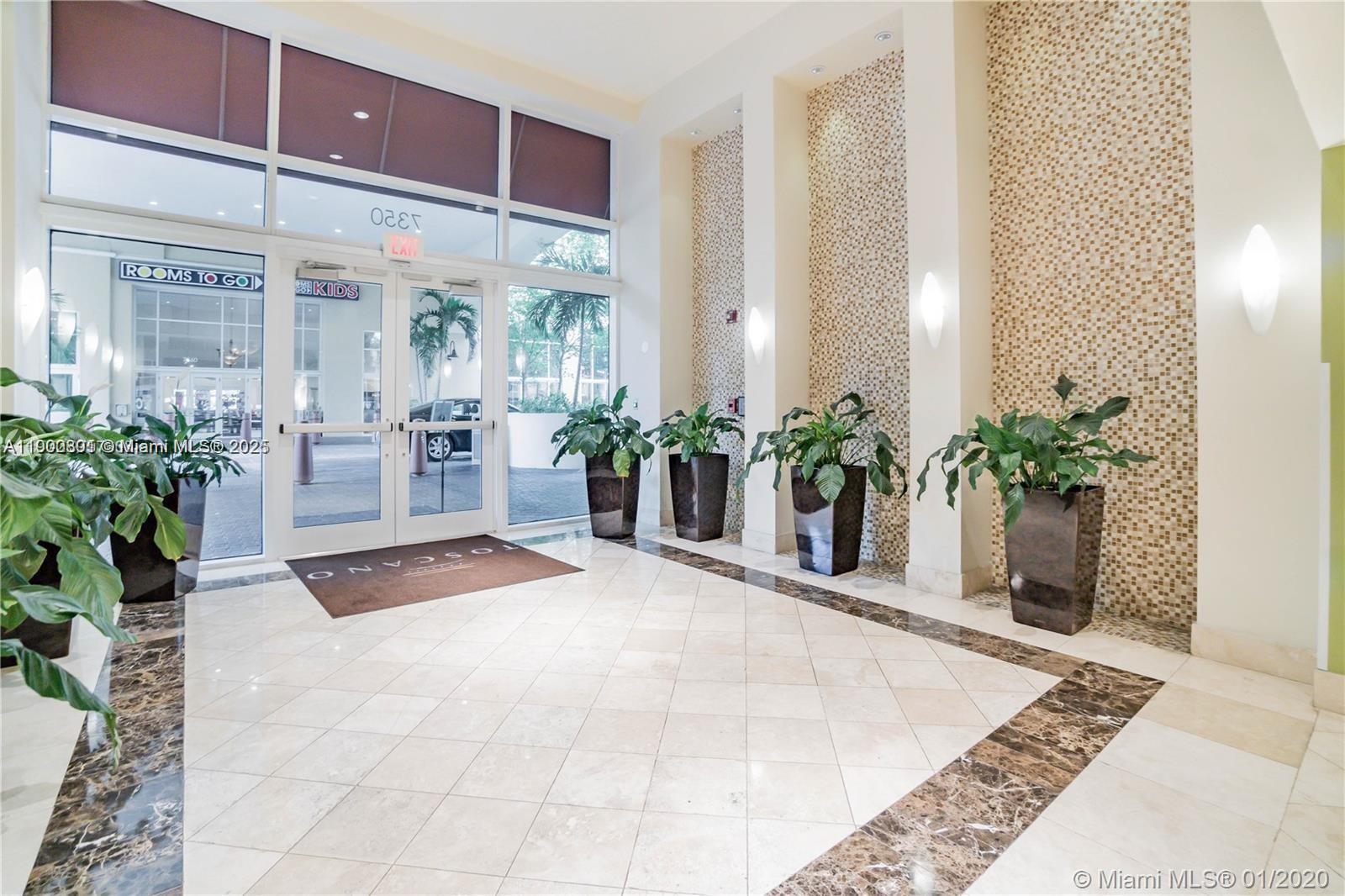 7355 Southwest 89th Street, Unit 501N Miami, FL 33156 - Photo 13 of 24 a potted plant sitting in front of a house