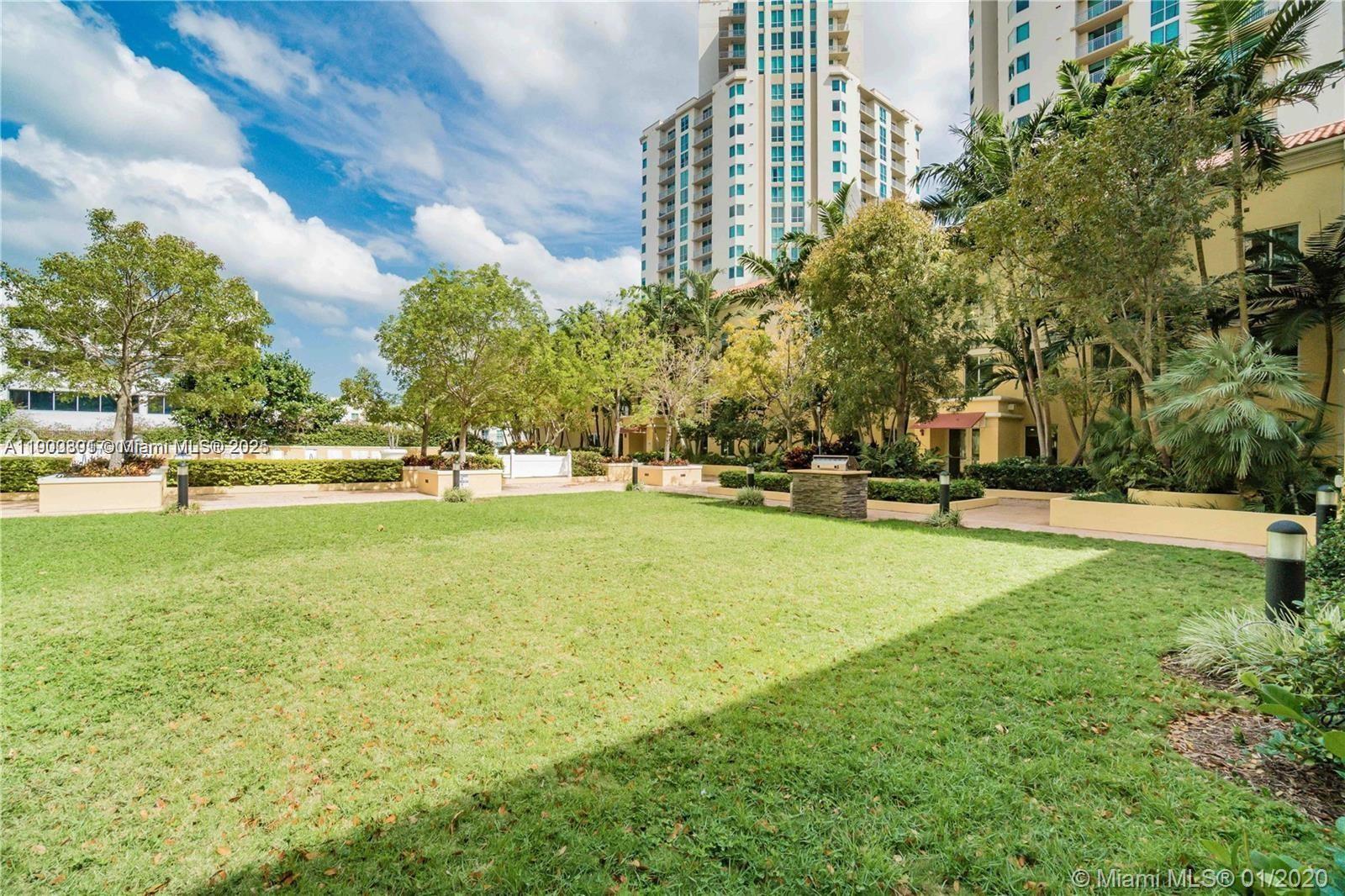 7355 Southwest 89th Street, Unit 501N Miami, FL 33156 - Photo 17 of 24 a view of outdoor space yard and trees