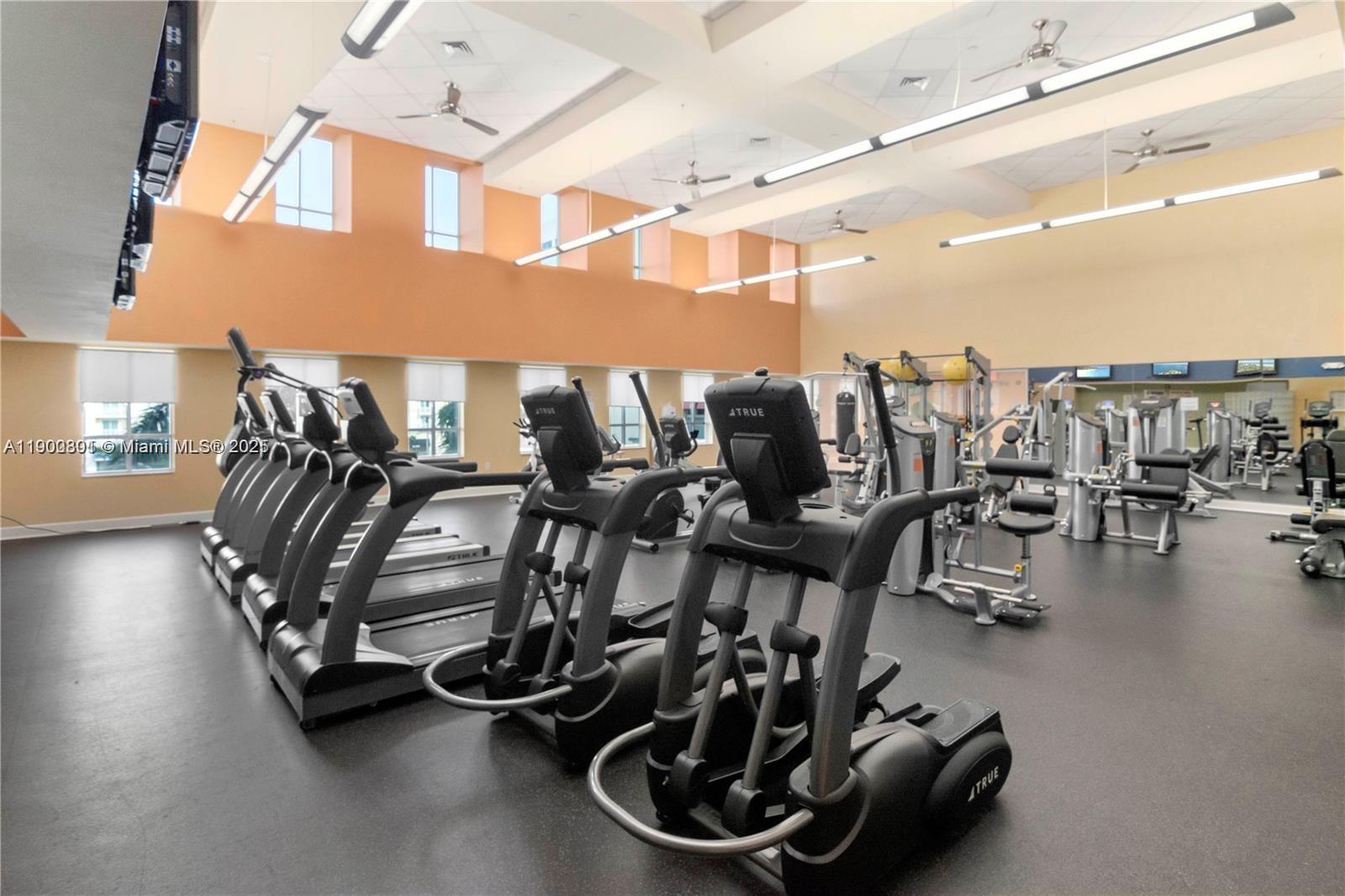 7355 Southwest 89th Street, Unit 501N Miami, FL 33156 - Photo 23 of 24 a room with gym equipment and wooden floor