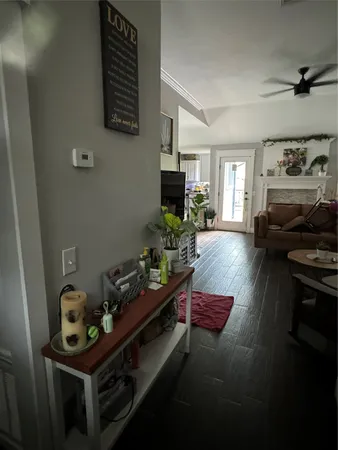 a room with water heater and wooden cabinets