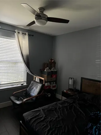a bedroom with a bed and a cabinets