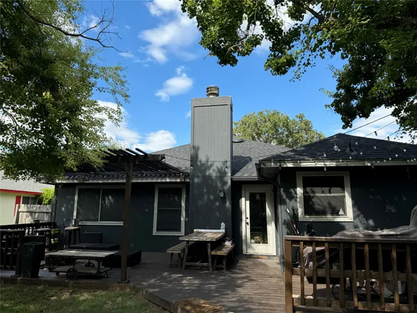 a kitchen with cabinets stainless steel appliances a sink and a window
