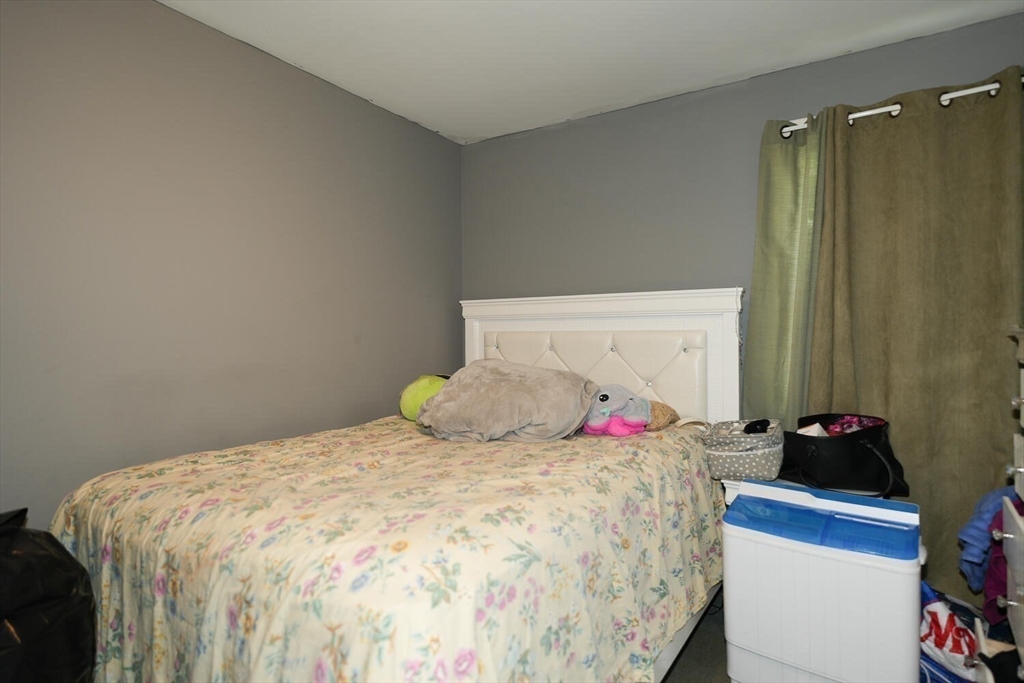 103 Devon Street Boston, MA 02121 - Photo 12 of 28 a bedroom with a bed and a closet