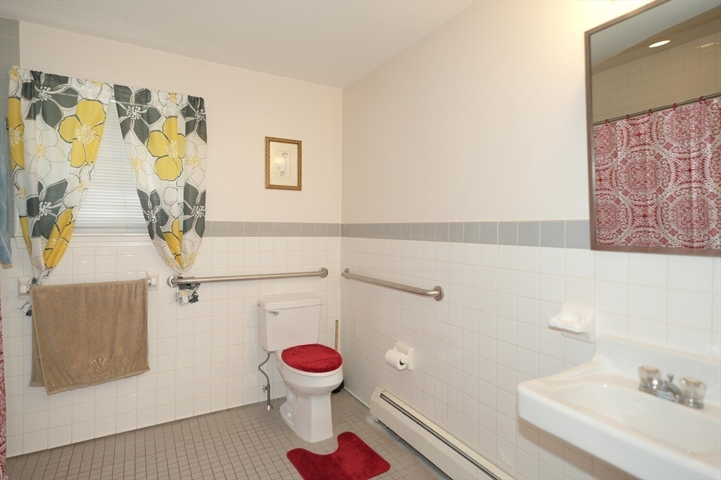 103 Devon Street Boston, MA 02121 - Photo 15 of 28 a bathroom with a sink and a toilet