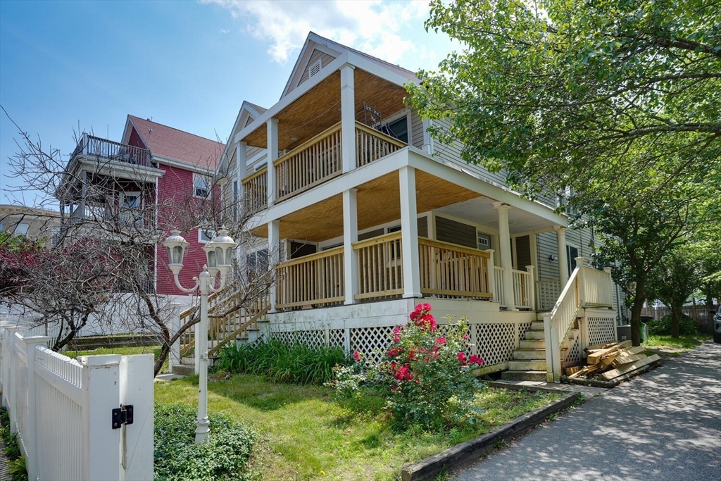 103 Devon Street Boston, MA 02121 - Photo 2 of 28 a front view of a house with garden