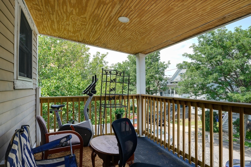103 Devon Street Boston, MA 02121 - Photo 22 of 28 a view of a chair in wooden deck