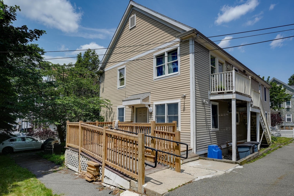 103 Devon Street Boston, MA 02121 - Photo 4 of 28 a view of a house with a yard and deck
