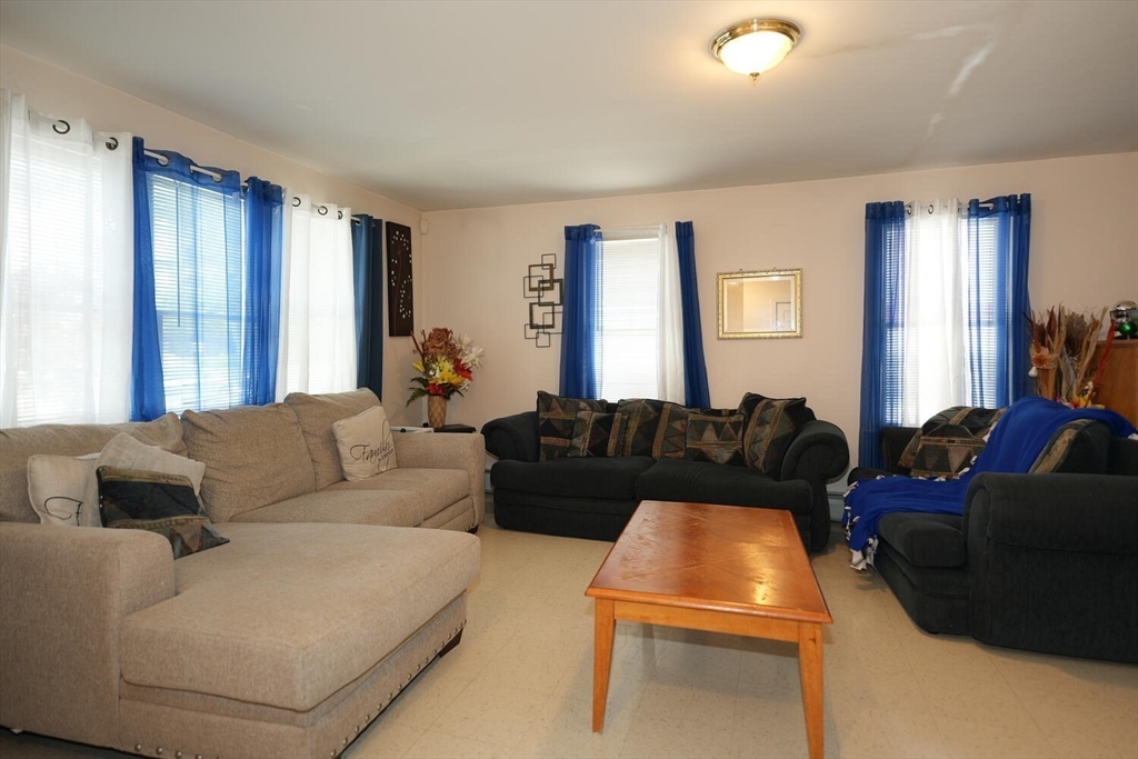 103 Devon Street Boston, MA 02121 - Photo 6 of 28 a living room with furniture and a window