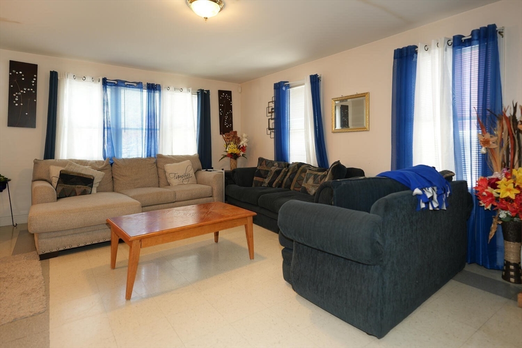 103 Devon Street Boston, MA 02121 - Photo 7 of 28 a living room with furniture and a window