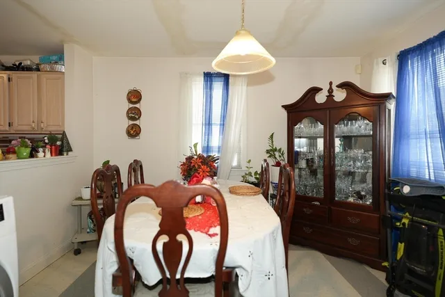 a dining room with a table and chairs