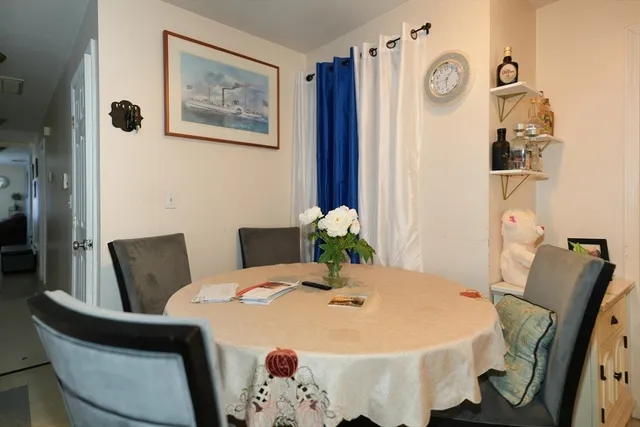 a close view of a dining room with furniture and wooden floor