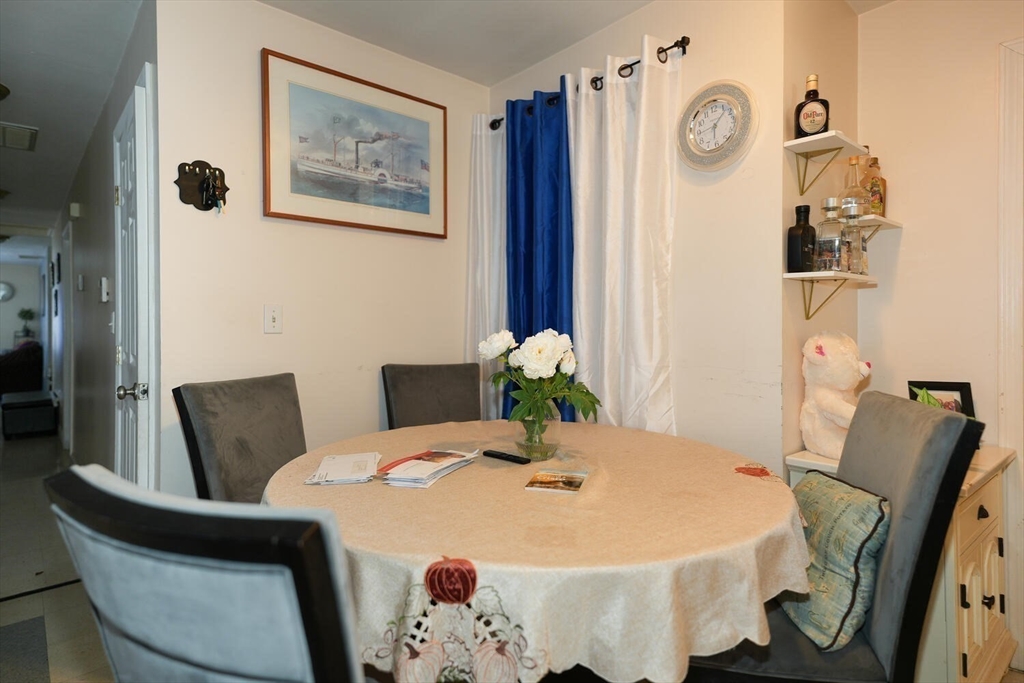 103 Devon Street Boston, MA 02121 - Photo 10 of 28 a close view of a dining room with furniture and wooden floor