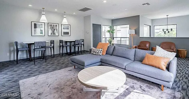 a living room with furniture and a table