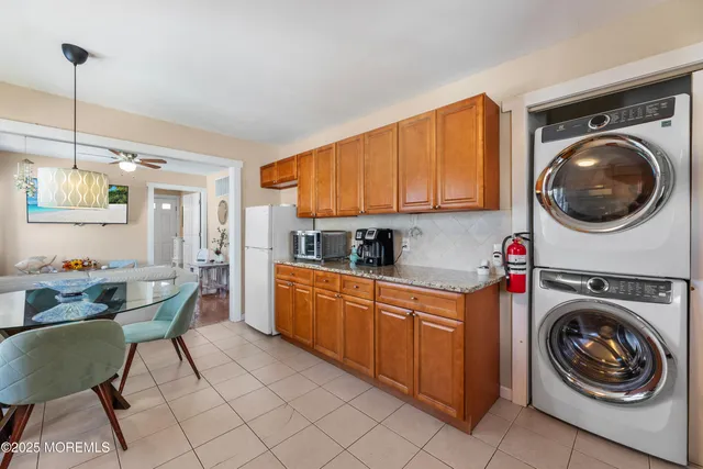a bedroom with a bed window and a chair